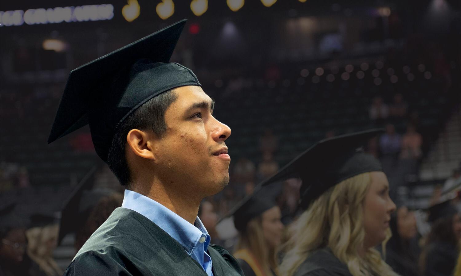 community college, a man in a graduation gown